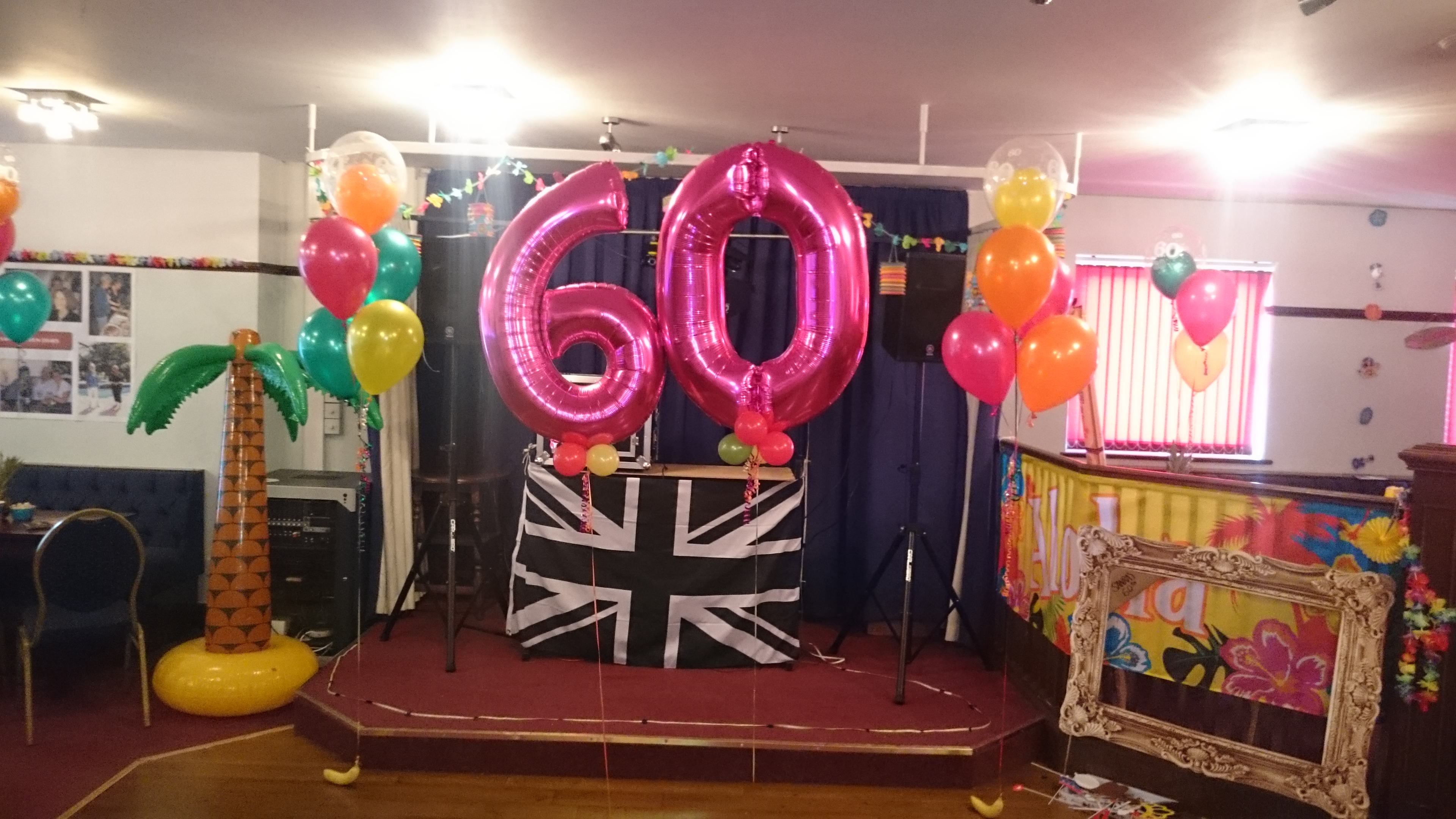 You are currently viewing 60th Birthday Party at The Coombe Social Club. Tropical Hawaiian Theme. Bouquets, Numbers and Fresh Fruit Weights